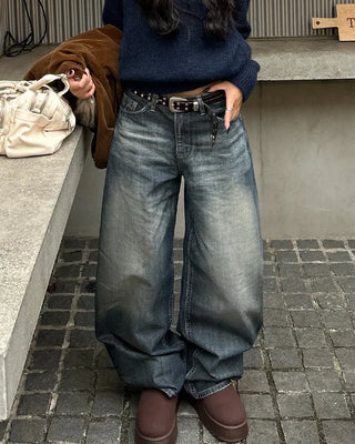Seam-stitched distressed wide-leg denim pants