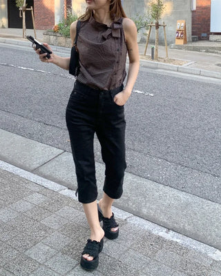 Checkered high-neck sleeveless blouse with bow tie