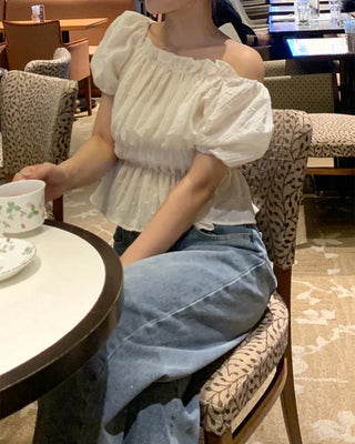Feminine gathered off-shoulder blouse