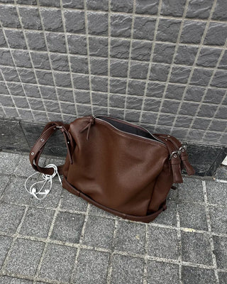 Drape-form buckle shoulder bag