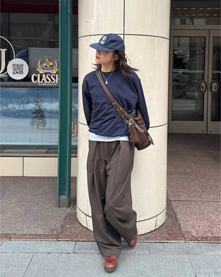 Drape-form buckle shoulder bag