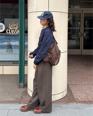 Drape-form buckle shoulder bag