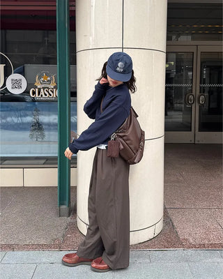 Drape-form buckle shoulder bag
