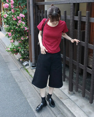 Side-button Bermuda shorts