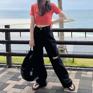 Distressed black denim pants