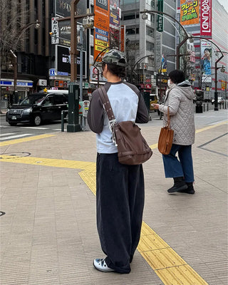Drape-form buckle shoulder bag