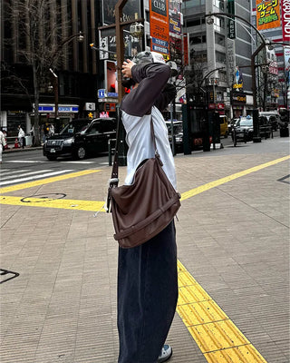 Drape-form buckle shoulder bag