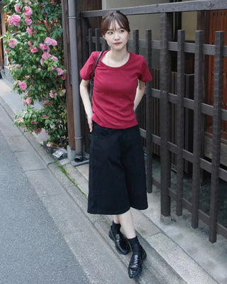 Side-button Bermuda shorts