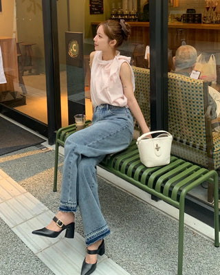 Sleeveless blouse with ribbon neckline