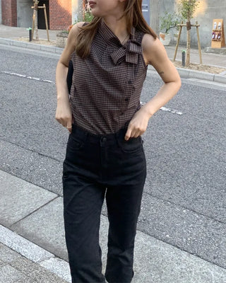 Checkered high-neck sleeveless blouse with bow tie