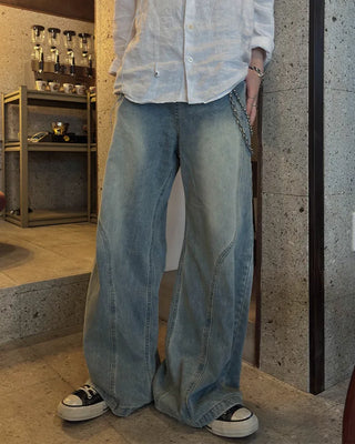 Curved silhouette denim pants