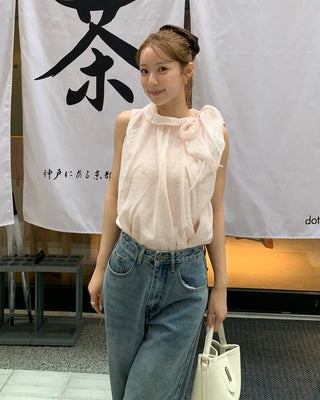 Sleeveless blouse with ribbon neckline