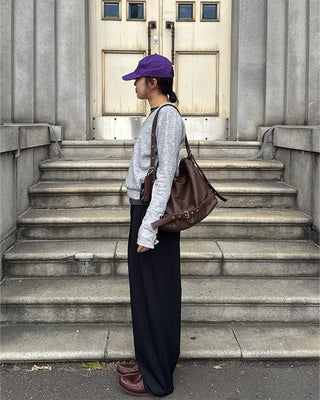 Drape-form buckle shoulder bag