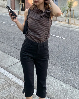 Checkered high-neck sleeveless blouse with bow tie