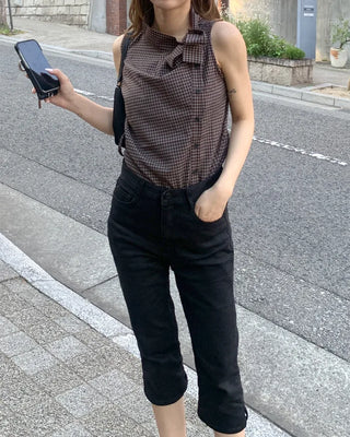 Checkered high-neck sleeveless blouse with bow tie