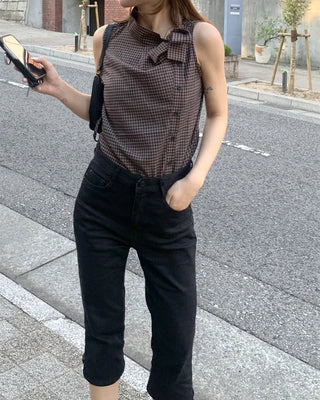 Checkered high-neck sleeveless blouse with bow tie