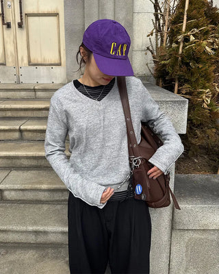 Drape-form buckle shoulder bag