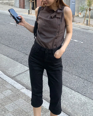 Checkered high-neck sleeveless blouse with bow tie