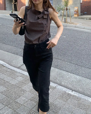 Checkered high-neck sleeveless blouse with bow tie
