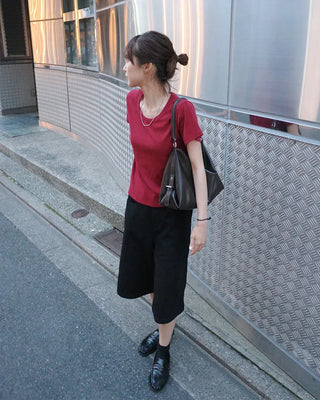 Side-button Bermuda shorts