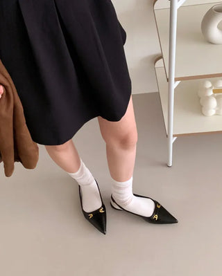 Pointed-toe slingback pumps