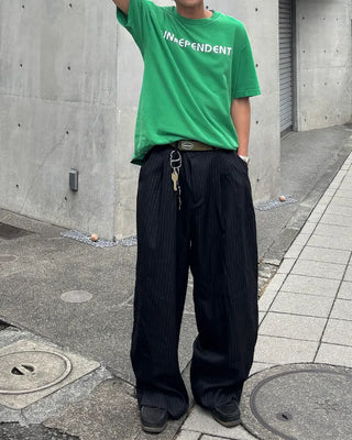 Double-pleated striped slacks