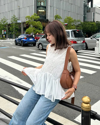 Perforated ruffle sleeveless top