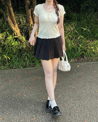 Belted pleated mini skirt