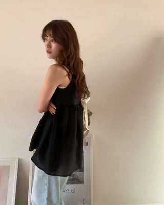Back-button sleeveless blouse