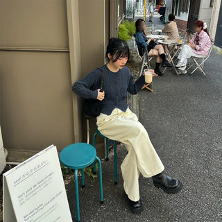 Tucked wide-leg pants
