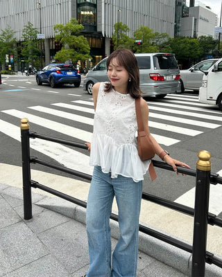 Perforated ruffle sleeveless top