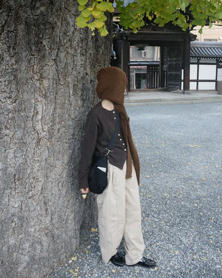 Side-tucked white cotton pants
