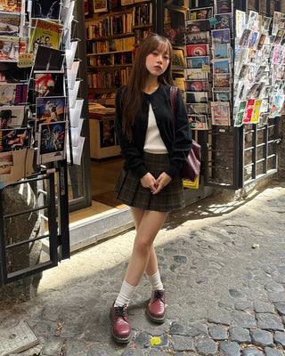 Checkered button pleated mini skirt