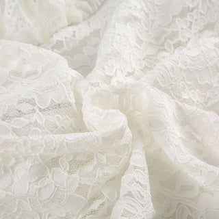 Long flared sleeve lace flower applique top