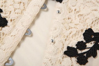 Off shoulder flower applique button top