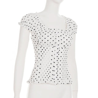 Polka dot cap sleeve button ruffle top
