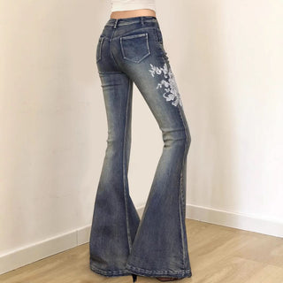 Embroidery button zip-up pocket low rise jeans