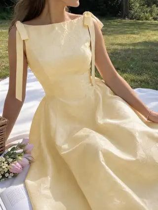 Jacquard Sculptural Boat Neck Bowknot Backless Flared Maxi Dress