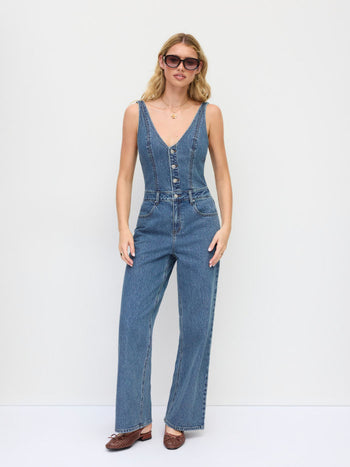 Stretch Denim Mid Rise Scoop Neckline Metal Detail Wide Leg Jumpsuit