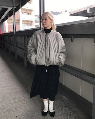 Asymmetrical pleated knit zip-up