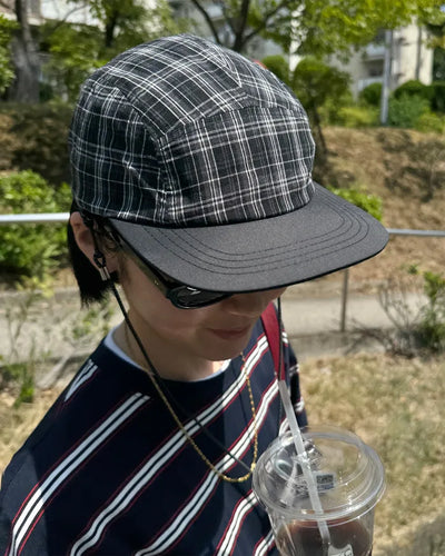 Checkered cap with drawstring