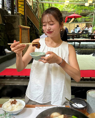 Sleeveless top with back slit