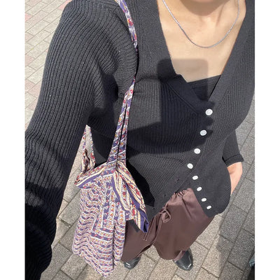 V-neck cardigan with waist-defining belt