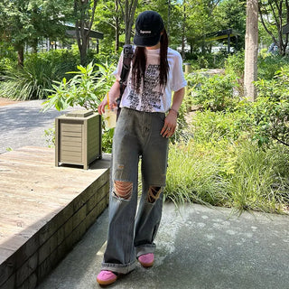 Distressed denim pants