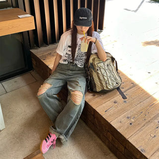 Distressed denim pants