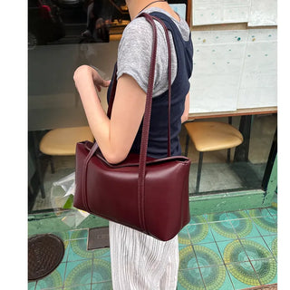 Slide pocket shoulder bag