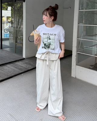 Wide-leg pants with pleats and peplum belt