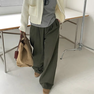 Wide-leg pants with buckle pleats