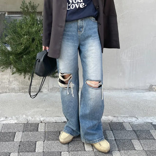Knee-ripped denim pants