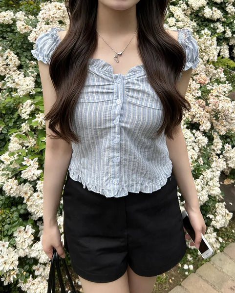 Frilled hem sleeveless blouse